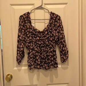 super cute american eagle top with a pretty floral pattern in size medium!